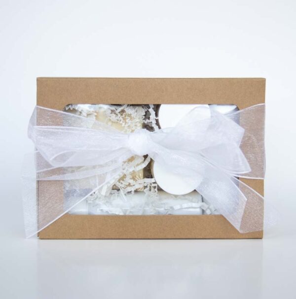 bath and body products in a gift box with ribbon
