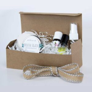 open gift box of breath well products